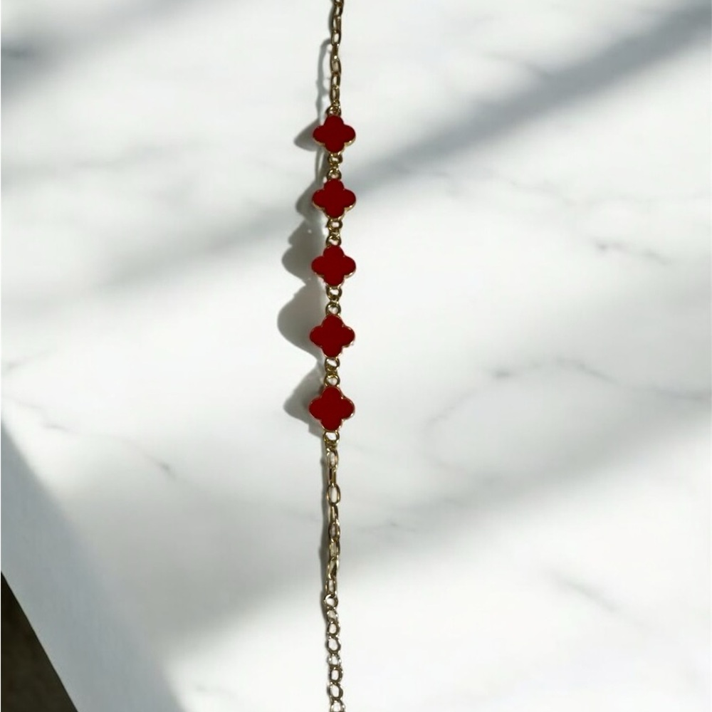 Elegant Gold and Red Clover Bracelet